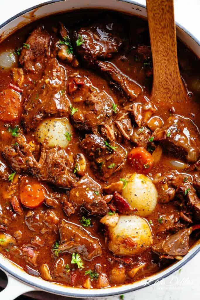 Tender fall apart chunks of beef simmered in a rich red wine gravy makes Julia Child's Beef