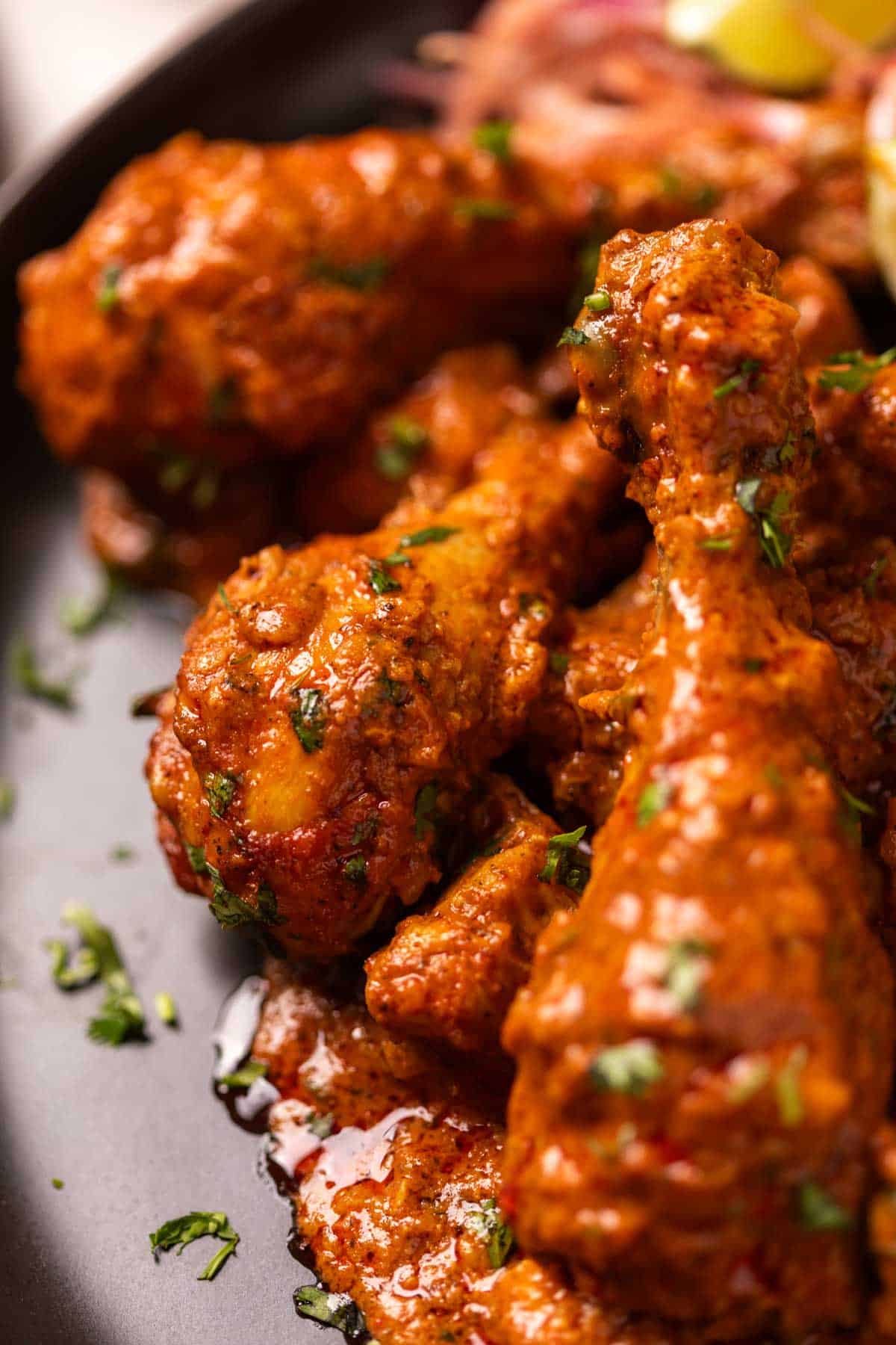 chicken handi served on a black plate