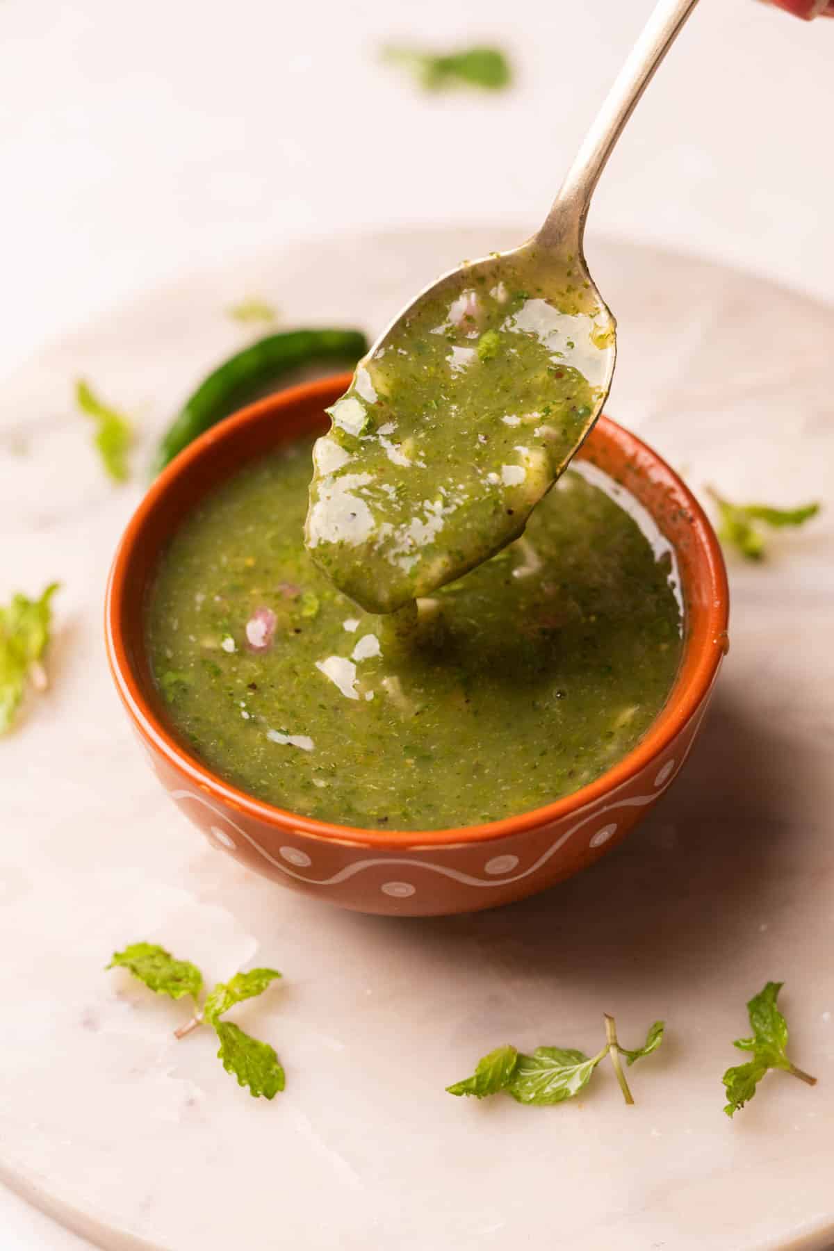 a little himachali mahni scooped up in a spoon to show it's thick texture