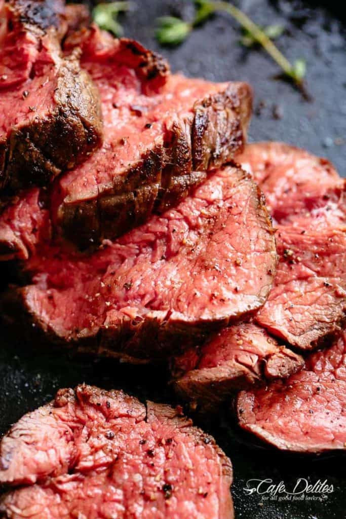 The best, juicy roast Beef Tenderloin slathered with garlic butter that melts in your mouth with every bite! Even better when served with a rich and rustic, easy to make red wine sauce (or jus).