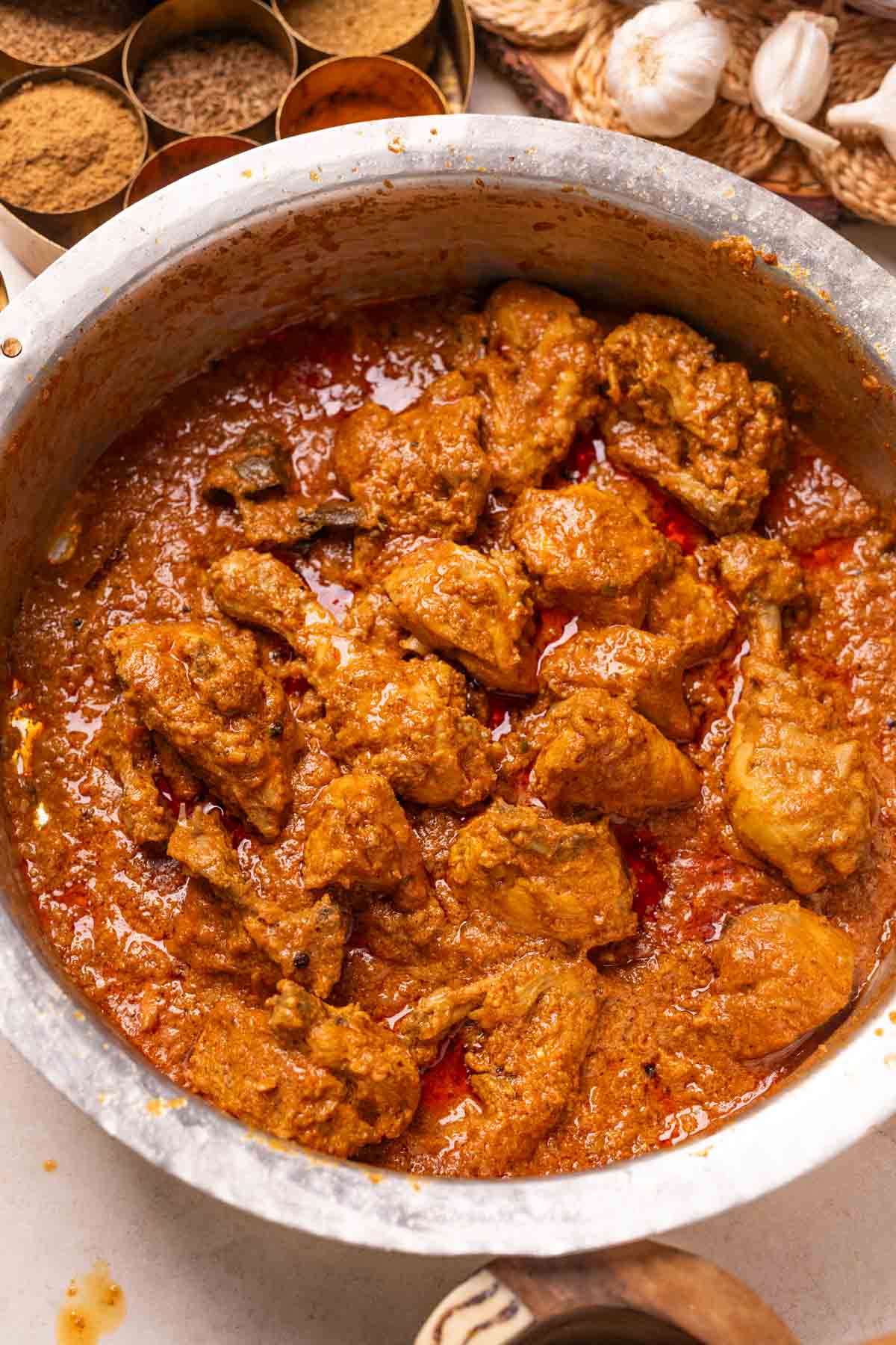 an image of chicken korma in a handi 