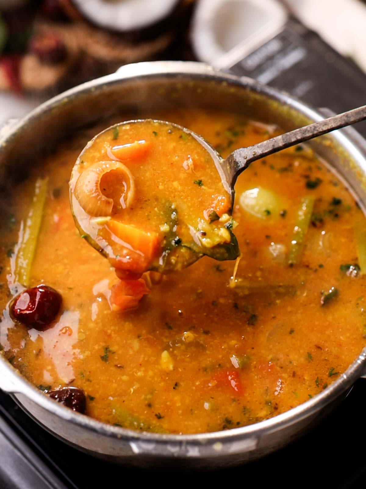 one pot sambar cooked in the pressure cooker with ladle 