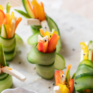 cucumber rolls served on a white platter