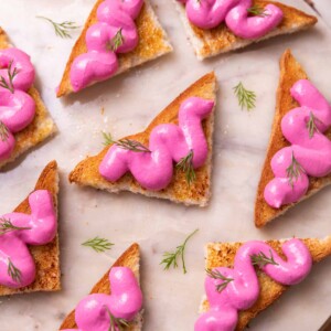 an image of several paneer toasts served on a round white platter