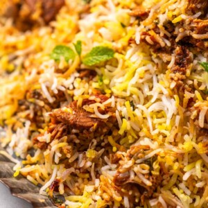 a close up image of jackfruit biryani garnished with mint leaves to show it's fluffy texture