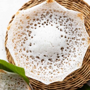 tender coconut appam in a wicker basket