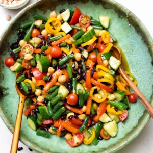three bean salad served with wooden spoons
