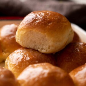 Single ladi pav stacked on top of other baked ladi pavs