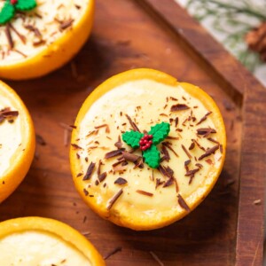 a close up image of orange posset dessert