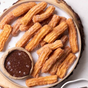 eggless churros served with chocolate sauce