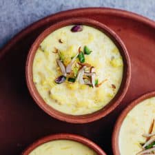Overhead shot of rice kheer in mud pots