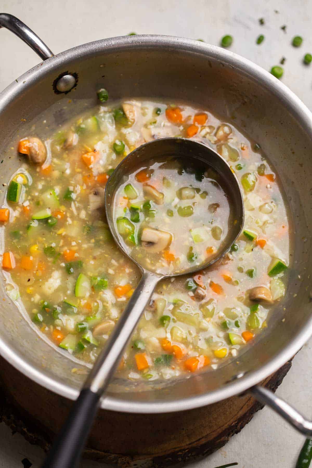 Freshly cooked Eight treasure soup still in the kadai with a ladle