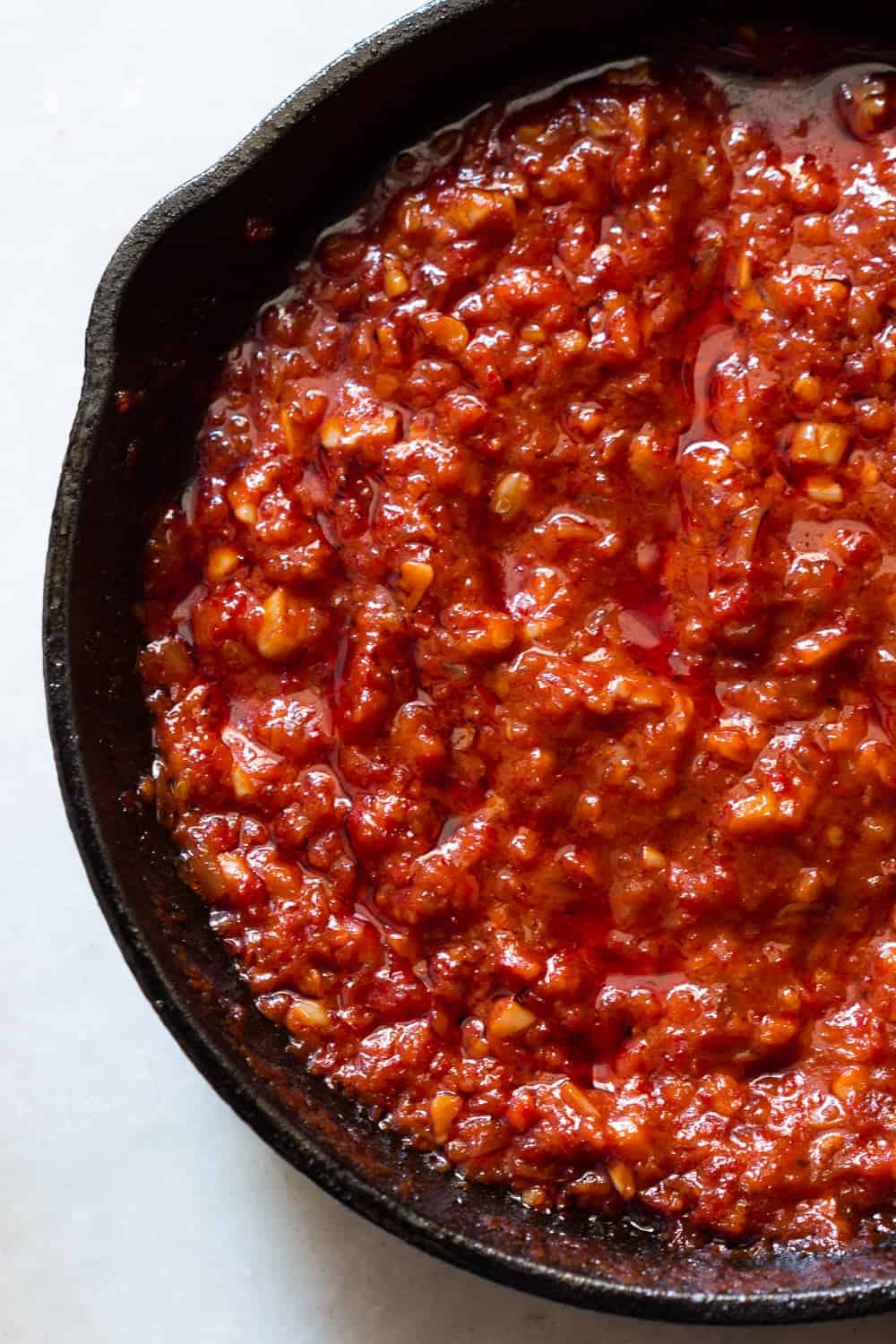 Learn how to make this simple schezwan sauce which is perfect with chicken lollipops, schezwan rice, noodles and manchurian (Step by step video recipe)