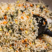 close up of basil fried rice in a pan to show it's fluffy texture