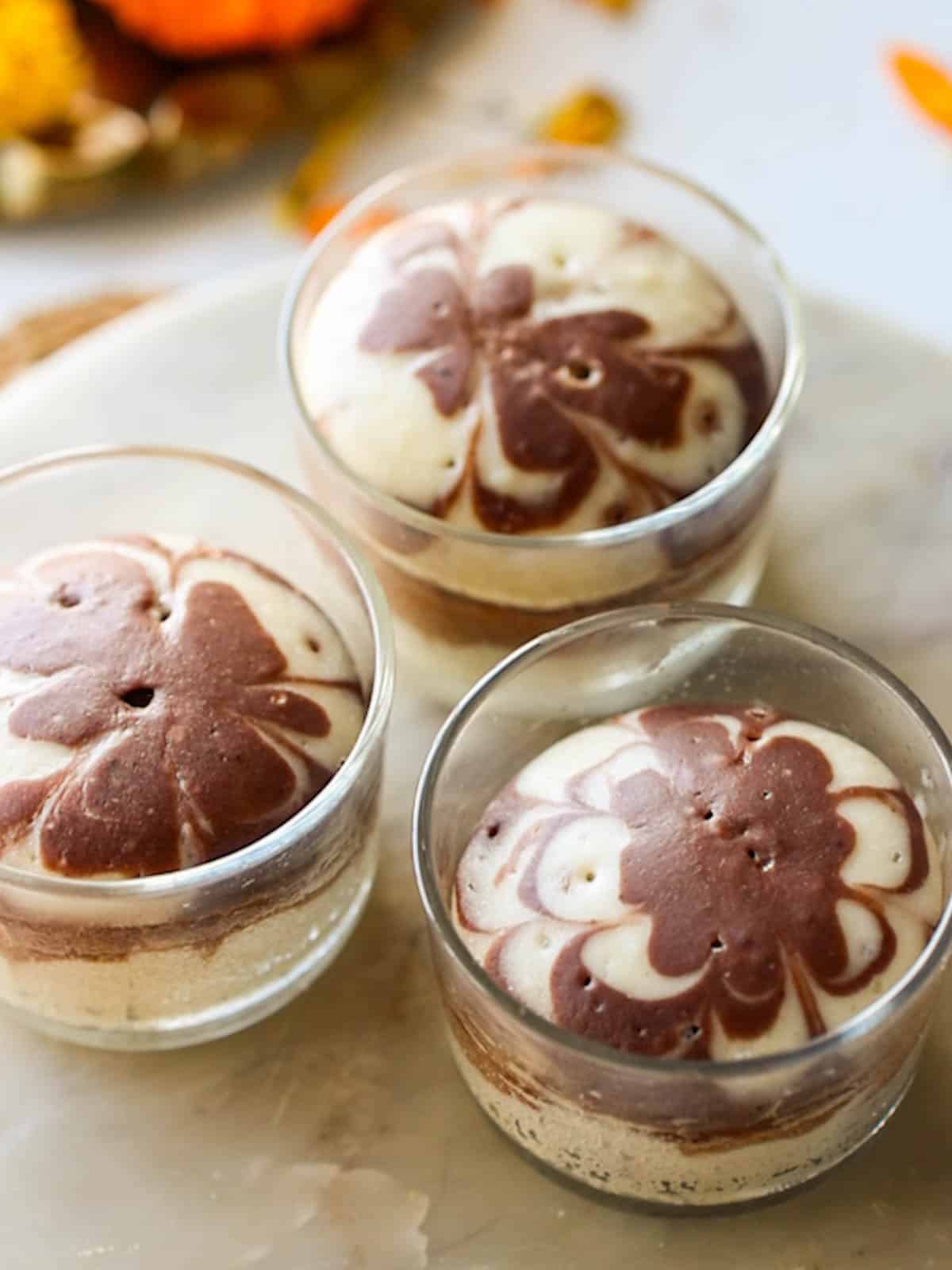 mini eggless marble cakes placed on a white board