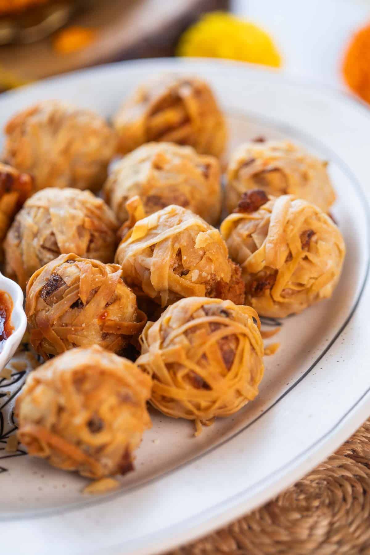 a close up image of firecracker crispy potato balls to showcase it's texture