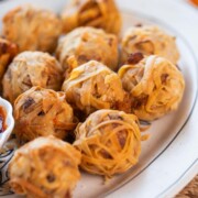 a close up image of firecracker crispy potato balls to showcase it's texture
