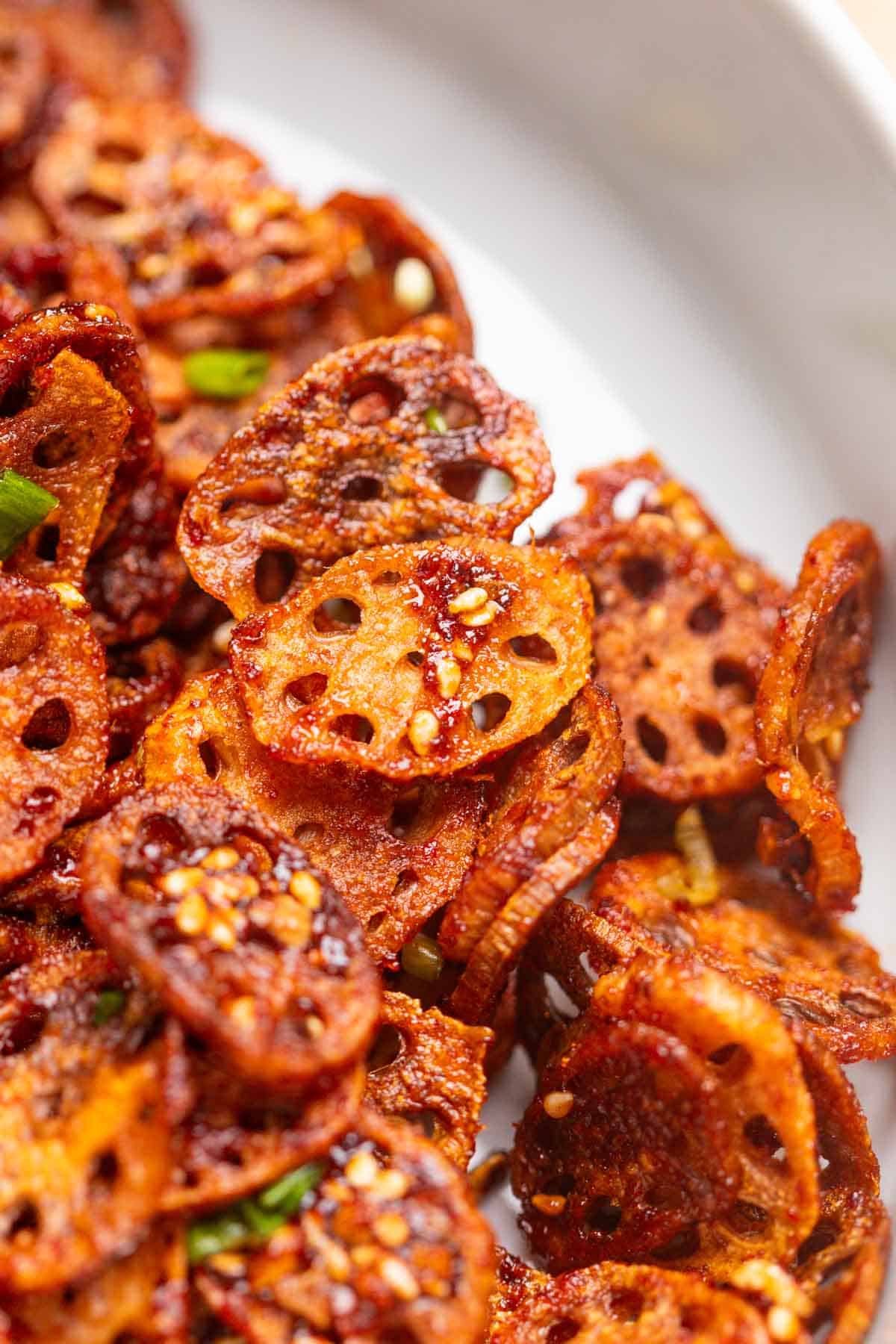 close up image of Korean crispy lotus stem to show it's thin and crispy texture