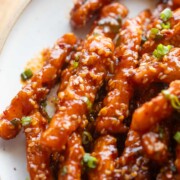 close up image of crispy honey chilli potatoes to showcase their texture