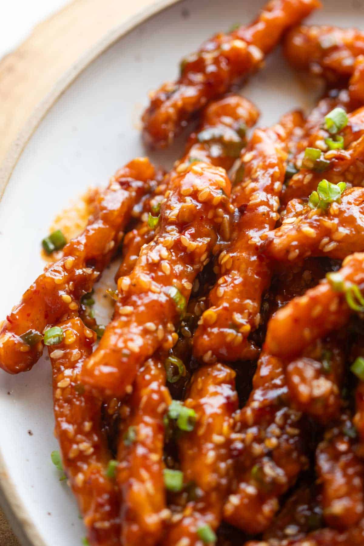 close up image of crispy honey chilli potatoes to showcase their texture 