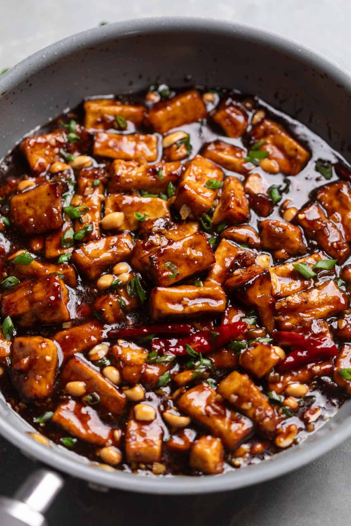 an image of kung pao tofu freshly cooked, still in the frying pan