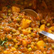 close up image of aloo matar sabzi to showcase it's and texture and consistency