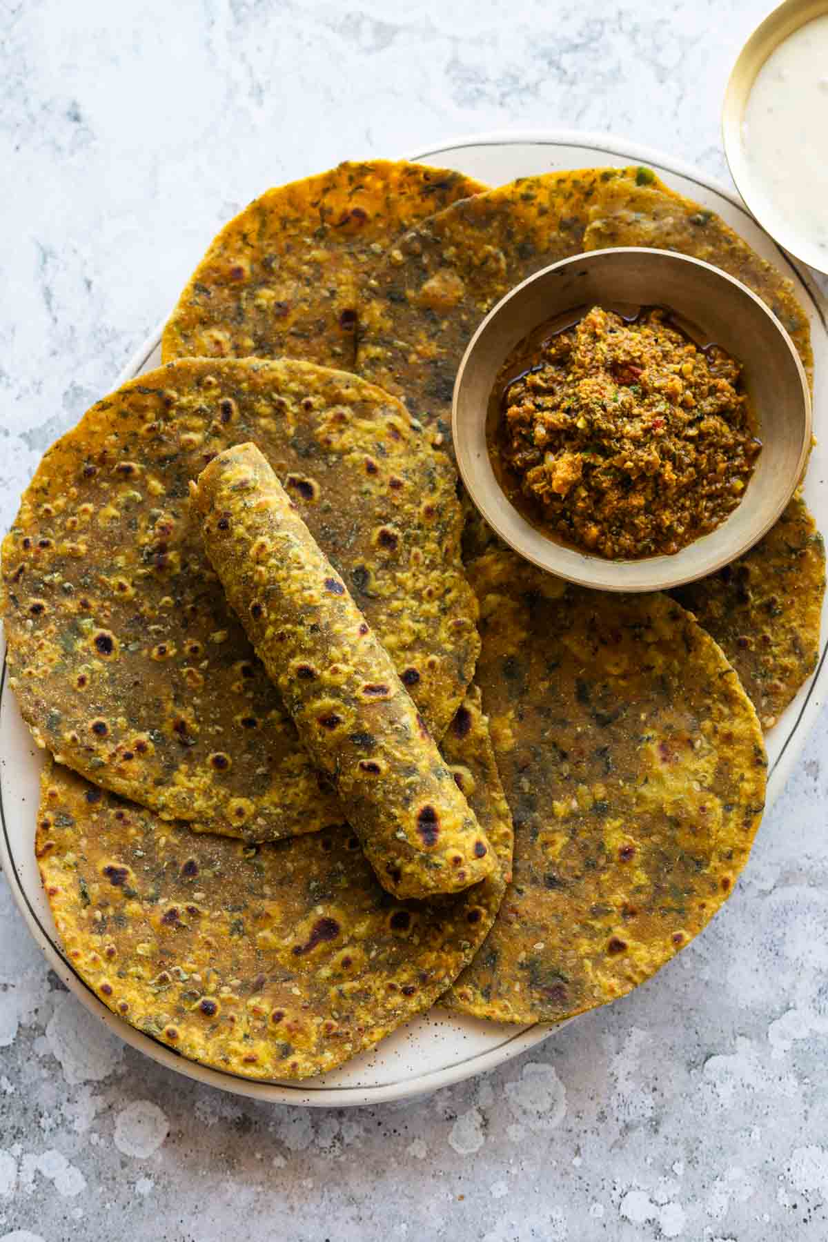freshly made methi thepla served with pickle