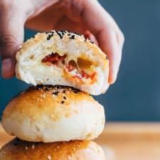 Bite shot of pepperoni cheese bombs showing the stuffing