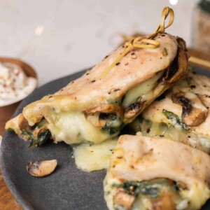 Spinach Mushroom Stuffed Chicken Breast plated on a grey plate