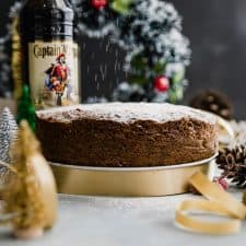 Last minute plum cake or christmas fruit cake set up on the table for slicing