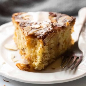 Close up of a slice of dundee cake to showcase the moist crumb
