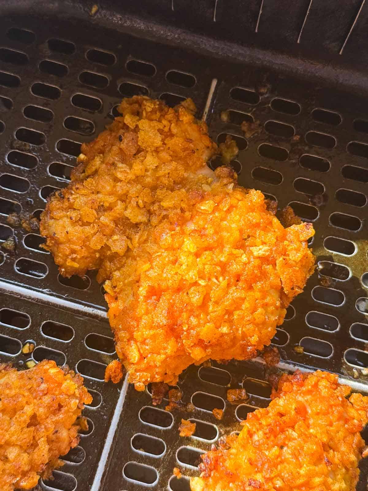 nashville fried chicken placed in the air fryer and ready to be cooked
