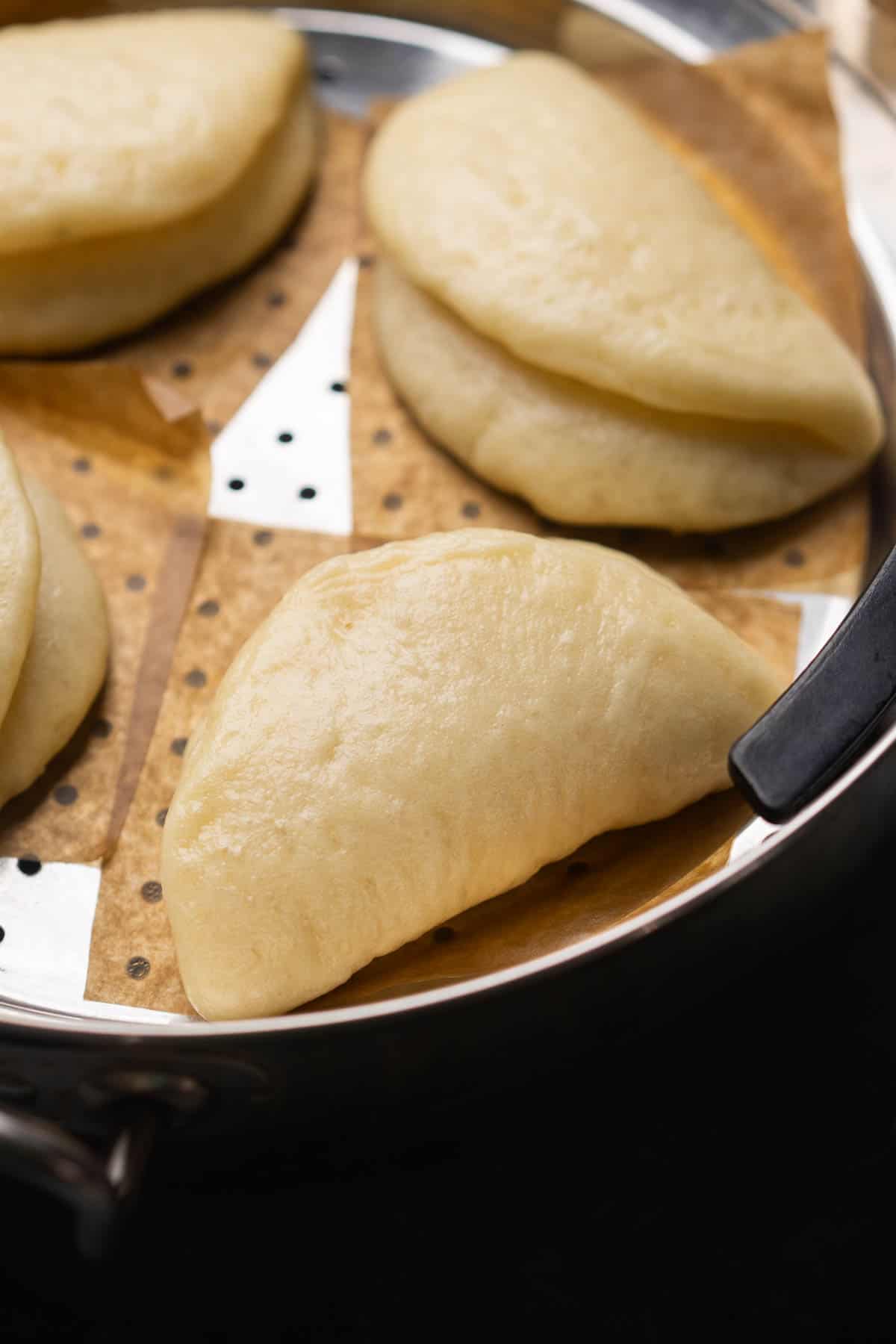 close up image of steamed bao buns to showcase their texture
