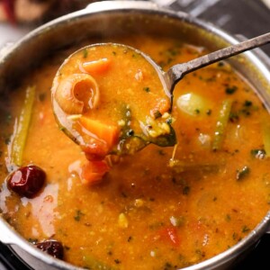 one pot sambar cooked in the pressure cooker with ladle