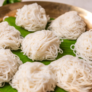 Rice idiyappams served on banana leaf in a plate
