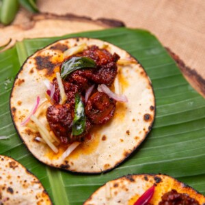 mushroom ghee roast tacos served on a leaf