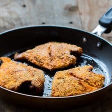 The fried fish coated with rava aka semolina in a pan.