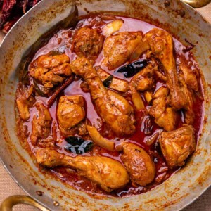 an image of freshly made nadan chicken curry in a kadai