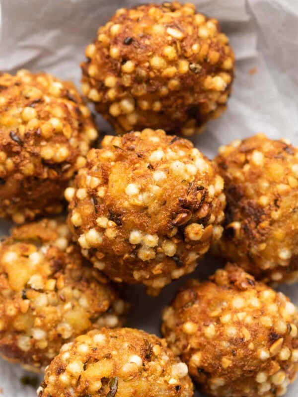 Closeup of sabudana vada bombs stuffed with paneer stacked on top of one another
