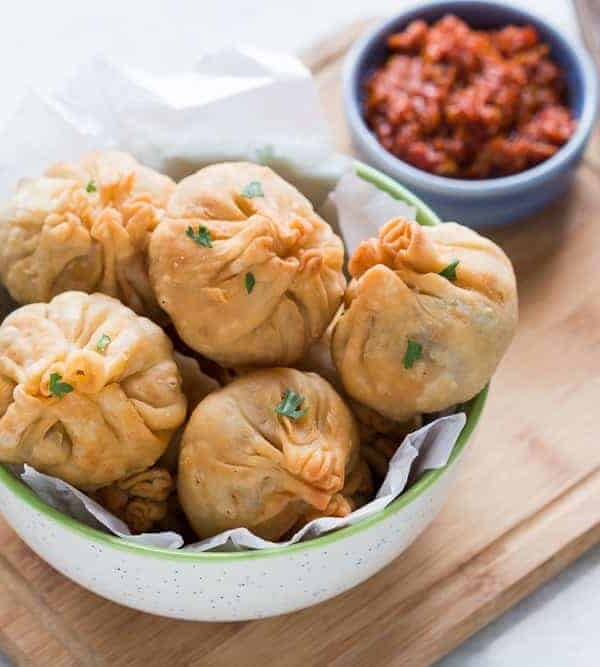 Chinese Potli Samosa Wontons served with a spicy schezwan sauce for dipping.
