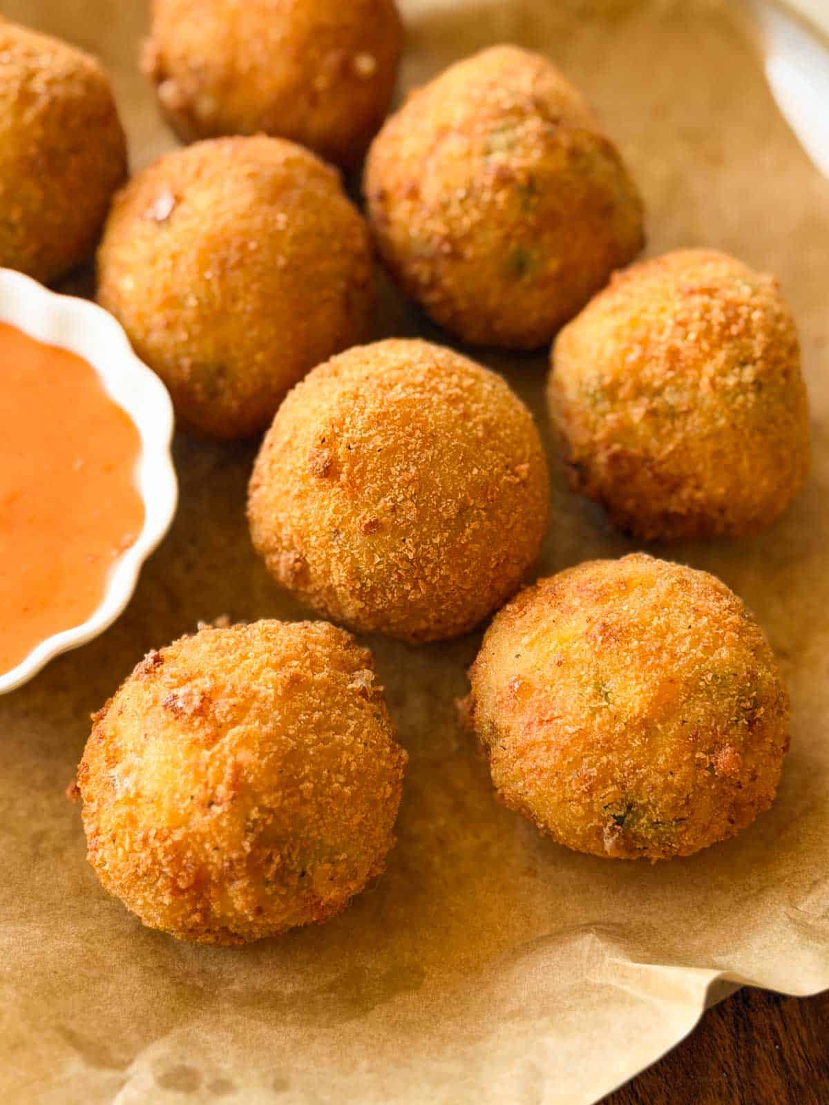 a close up image of cheese balls to showcase their crispy texture