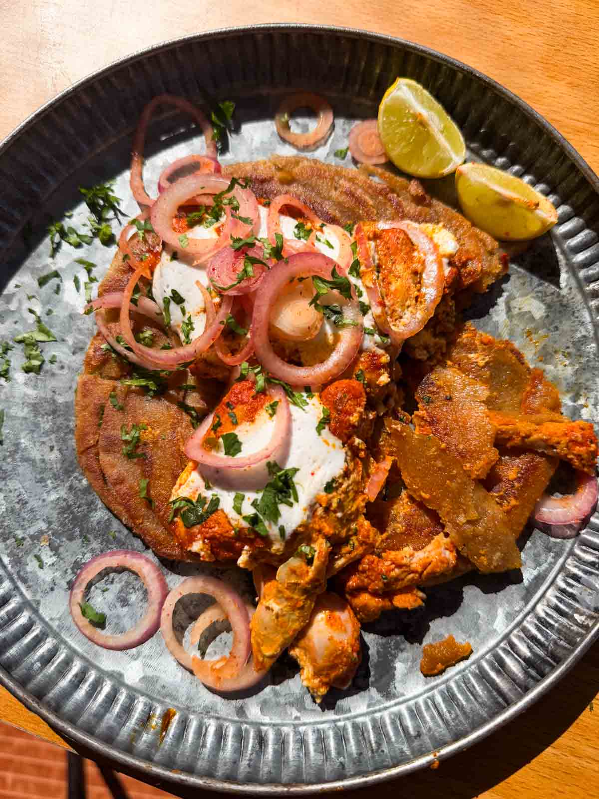 iffa chicken served on a plate with accompaniments