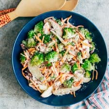 Creamy Apple Broccoli Walnut Salad served in a blue bowl.
