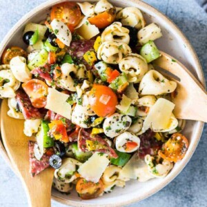 Italian Antipasto Tortellini Pasta Salad put together in a white bowl.