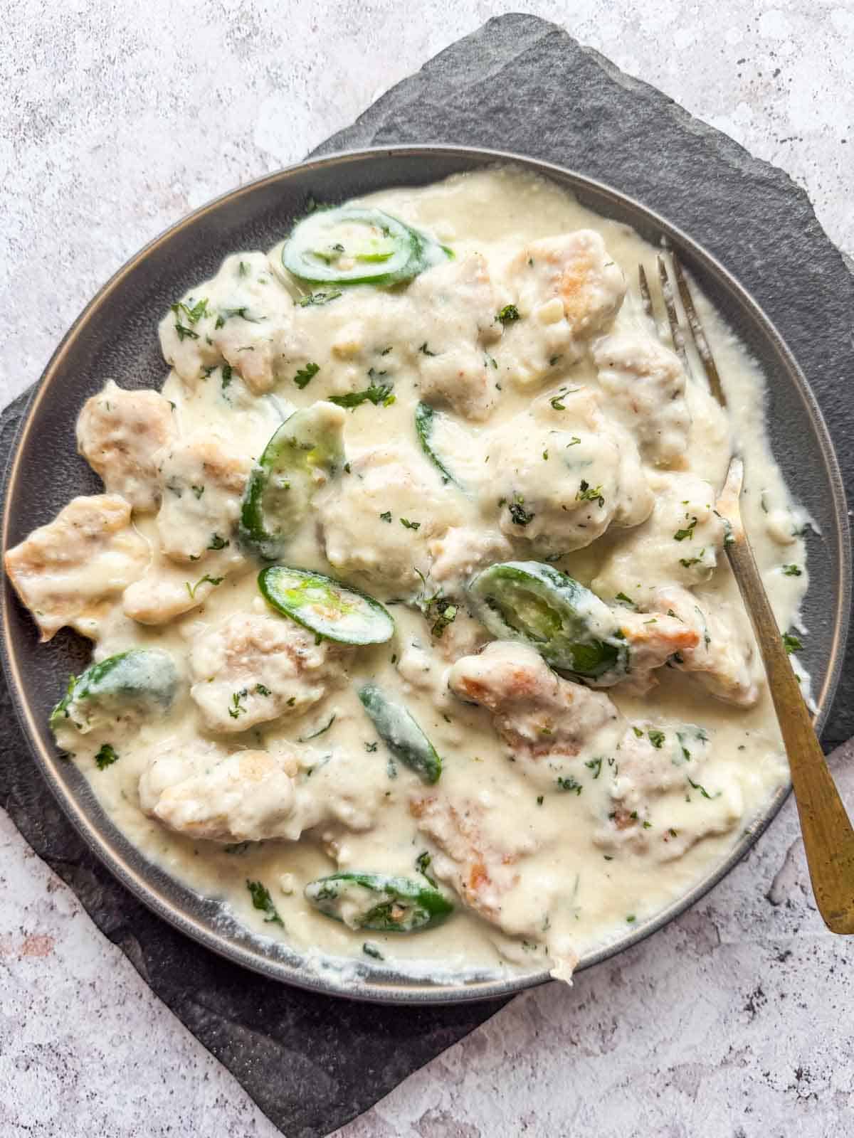creamy japan chicken served on a plate with fork