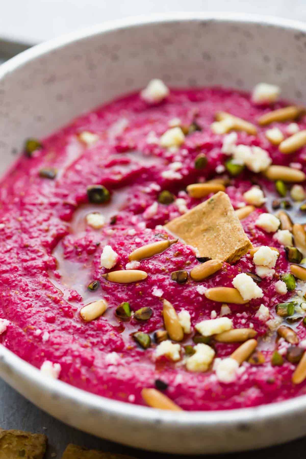 Egyptian Beetroot Dip in a white speckled bowl.