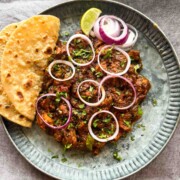 Indian chicken roast served with accompaniments