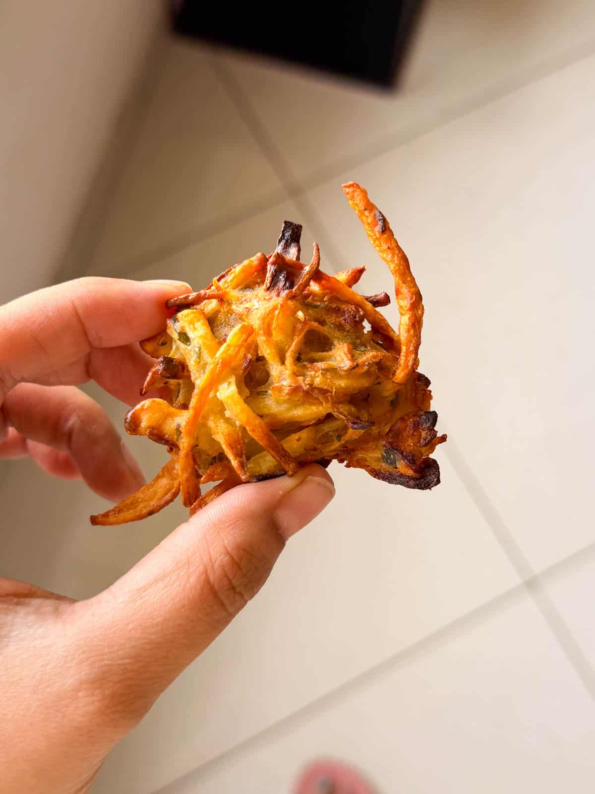 a close up image of air fryer veg pakora to show it's crispy texture