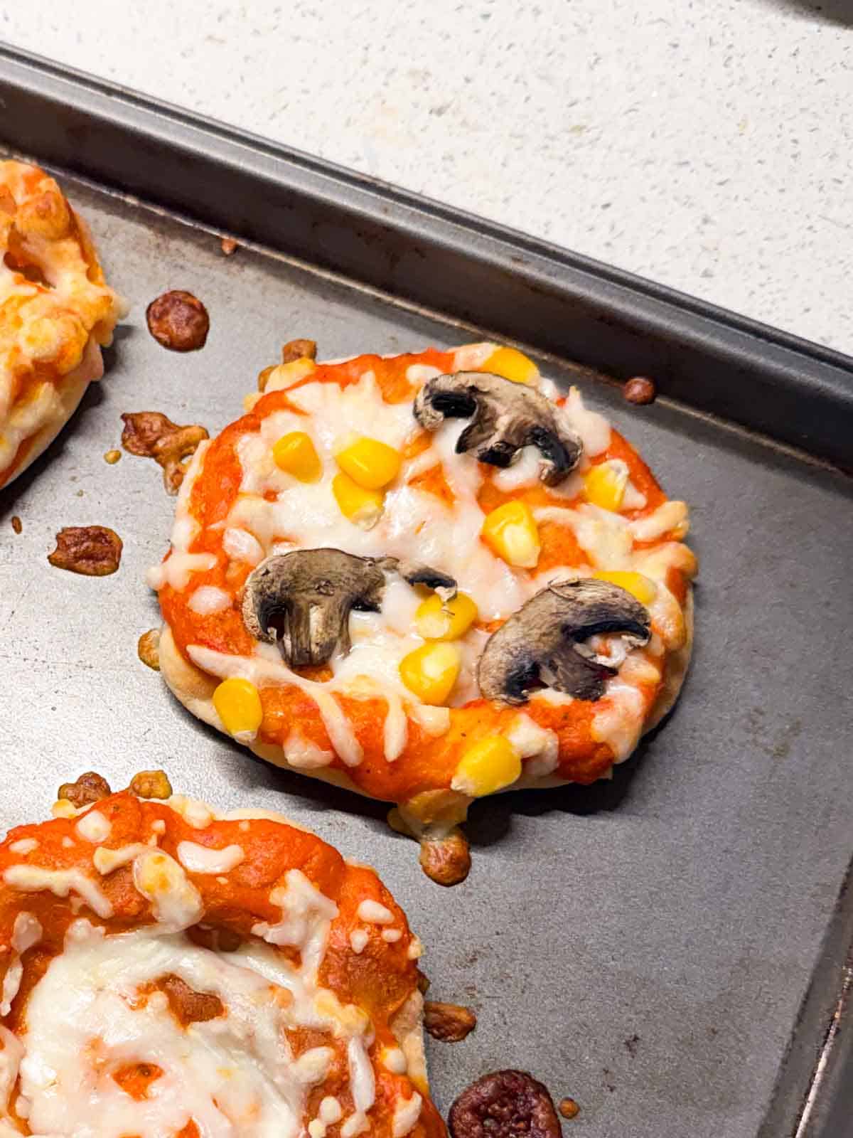 close up image of a mini veg pizza