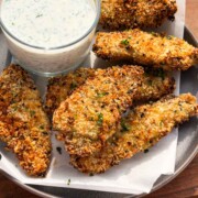 Air Fryer Chicken Tenders served in a grey plate with dill yogurt dip